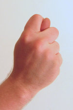 Gesture_fist_with_thumb_through_fingers.jpg